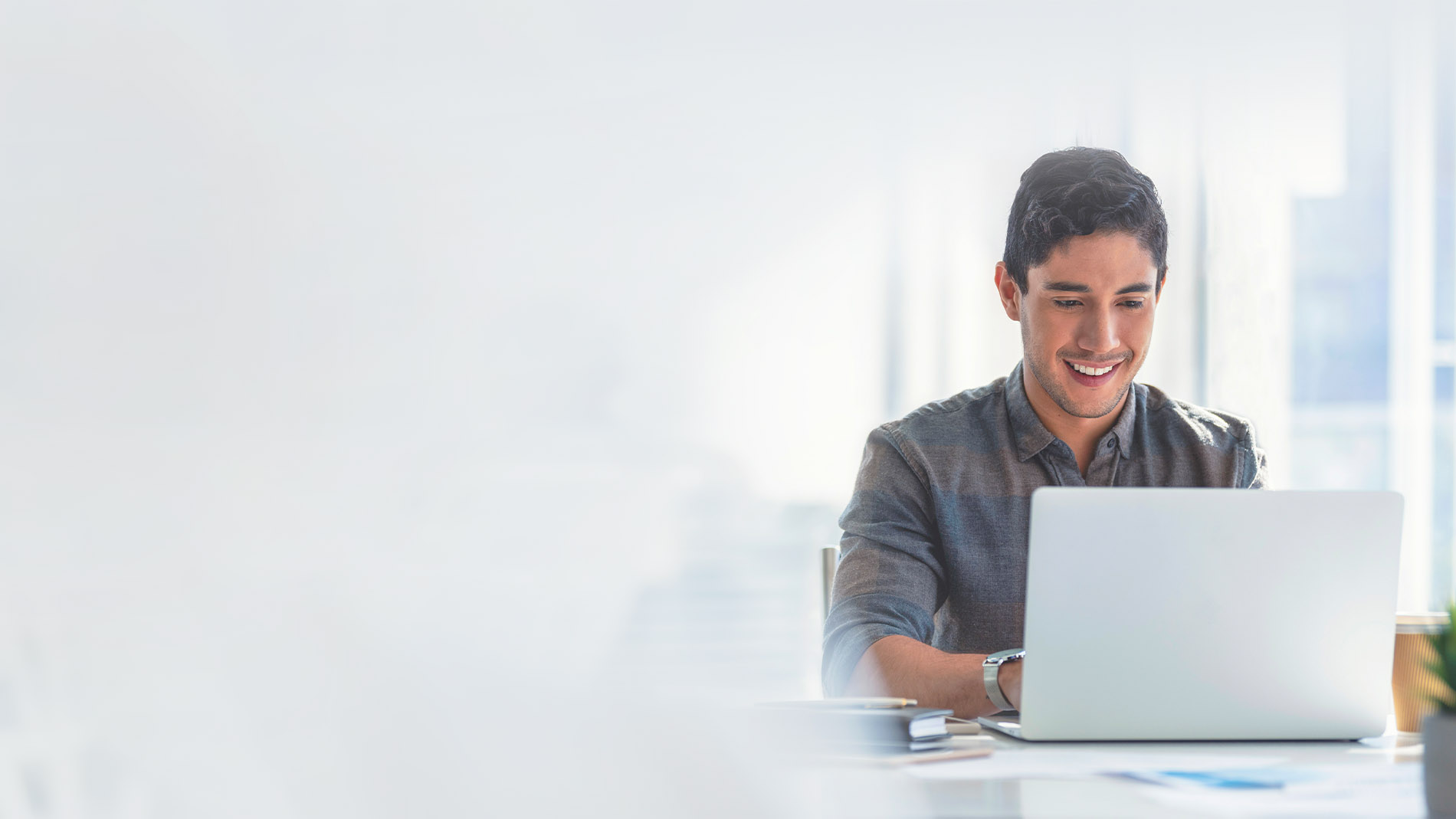 Man using laptop at a desk