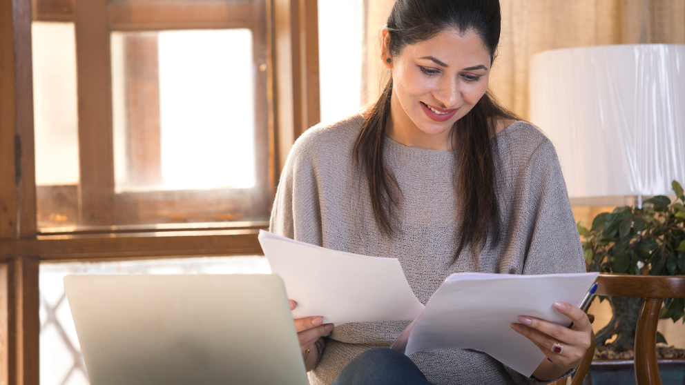 Woman reviewing paper work.