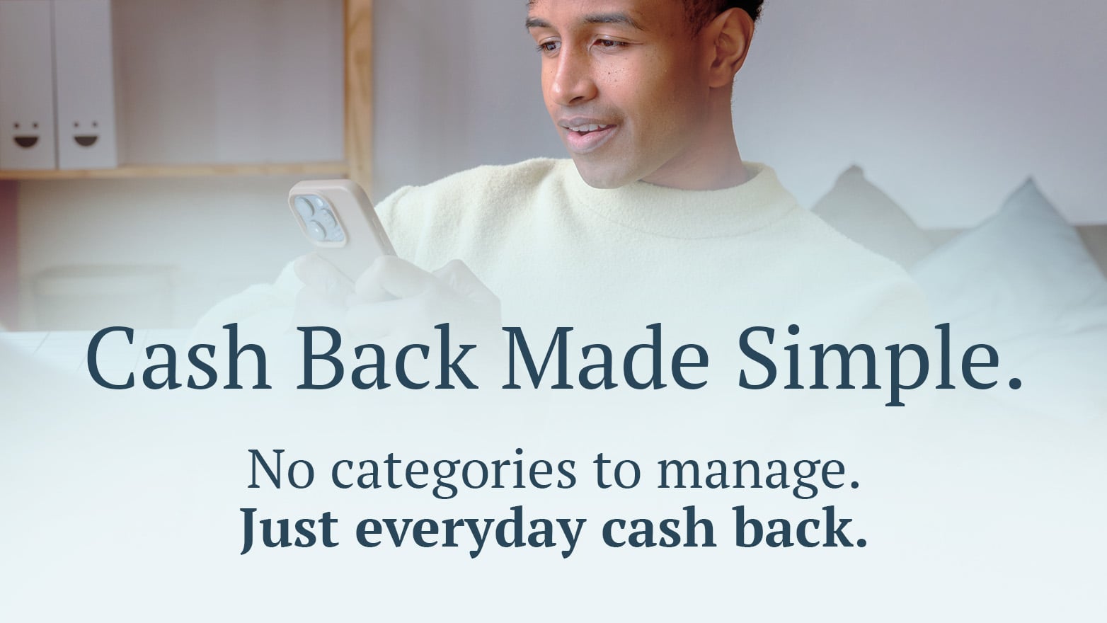 Man with mobile phone. Text: "Cash back made simple. No categories to manage. Just everyday cash back.""