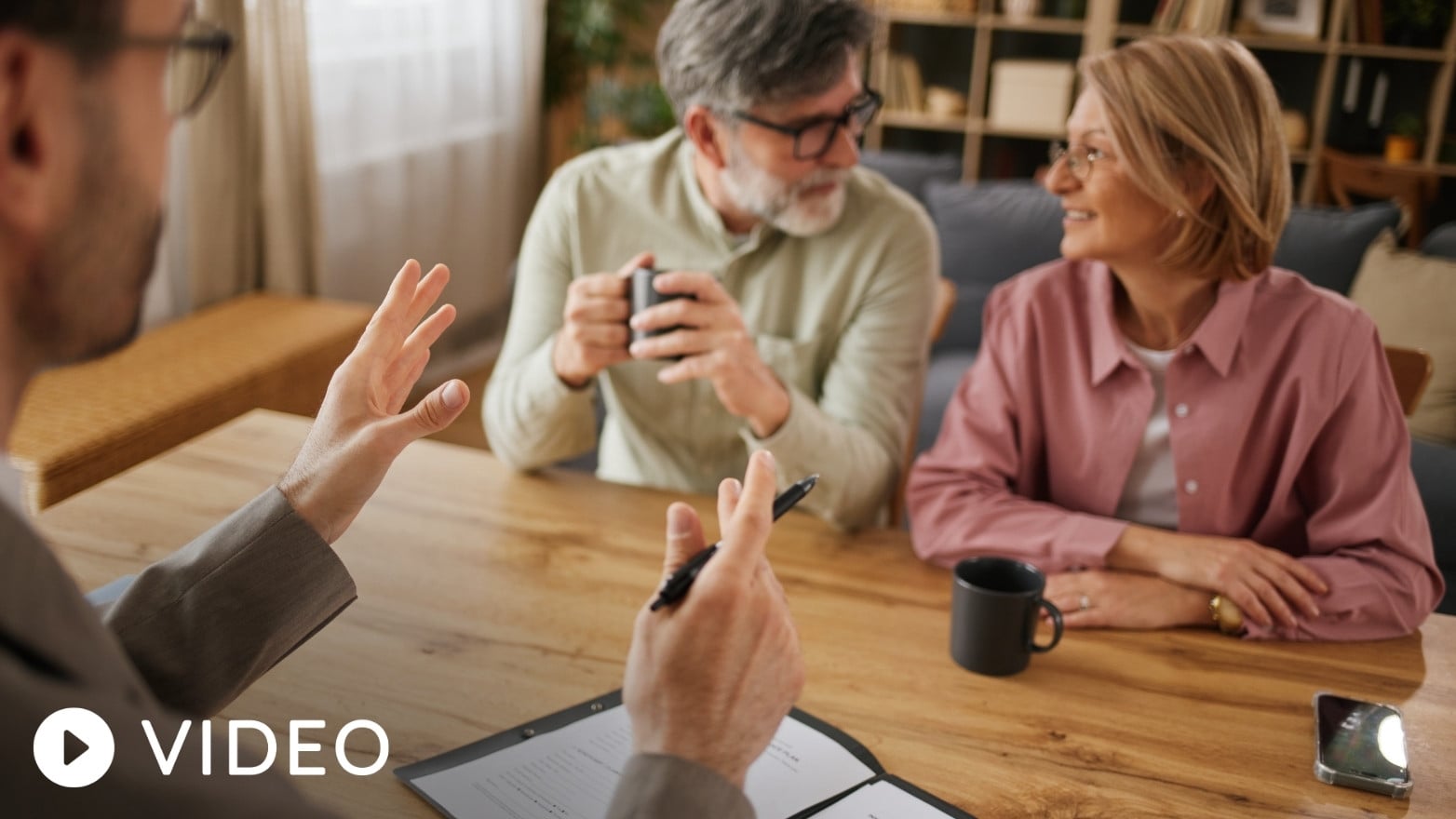 Financial professional meeting with clients to discuss estate planning and wealth transfer strategies.