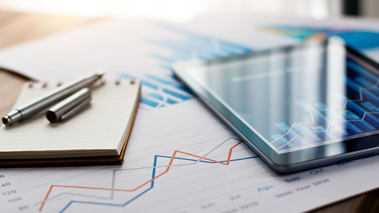 view from above of financial reports on desk