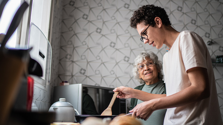 Young adult working with grandparent