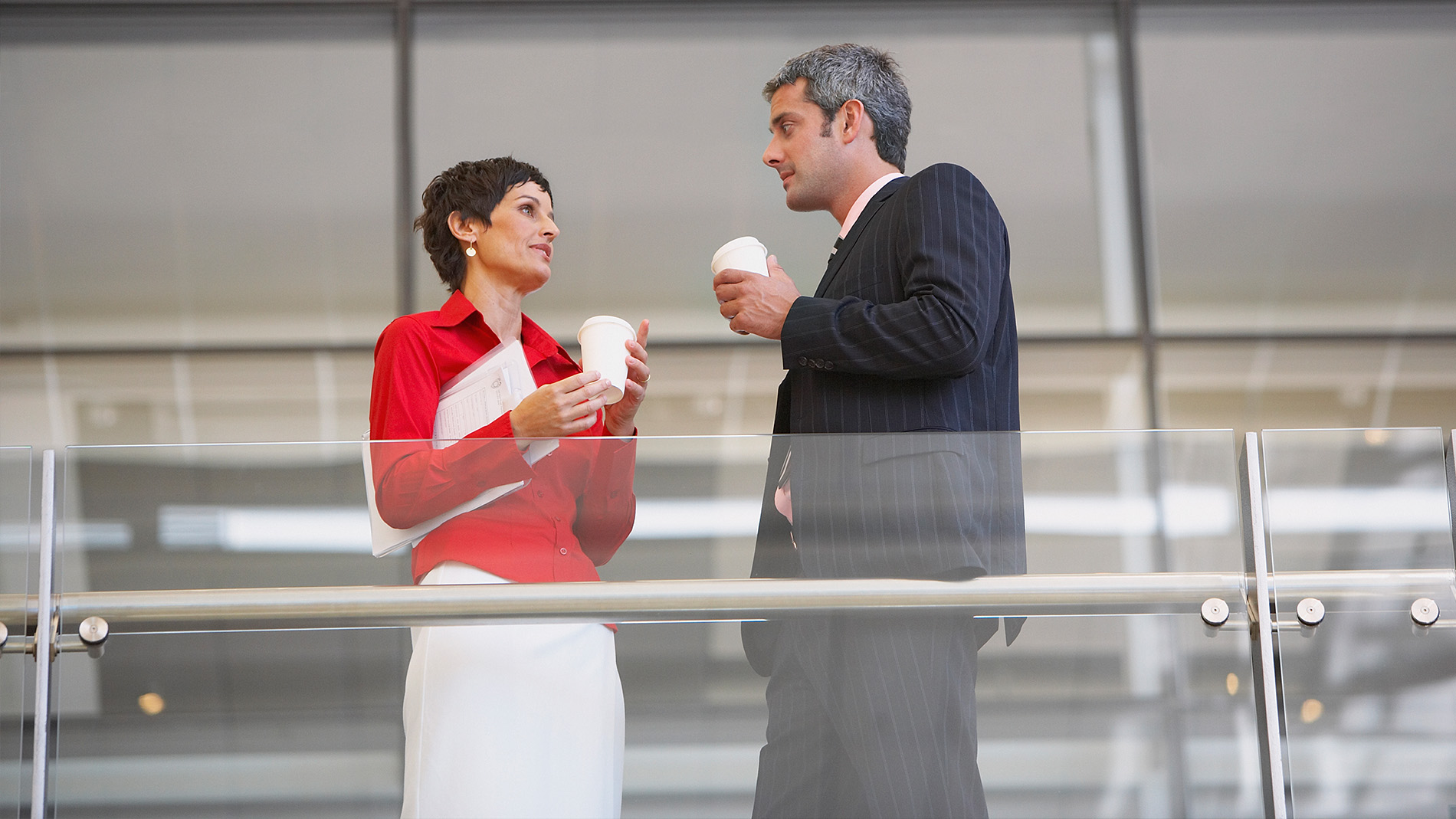 coworkers talking with coffee