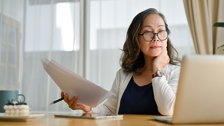 Woman looking at financial documents