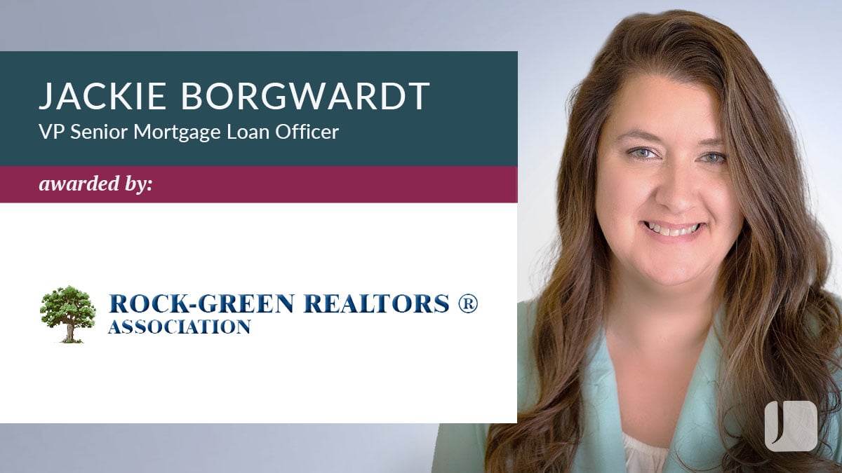 Graphic featuring a professional head‑and‑shoulders portrait on the right and text on the left reading “Jackie Borgwardt, VP Senior Mortgage Loan Officer,” with “awarded by Rock‑Green Realtors Association” and the association logo.