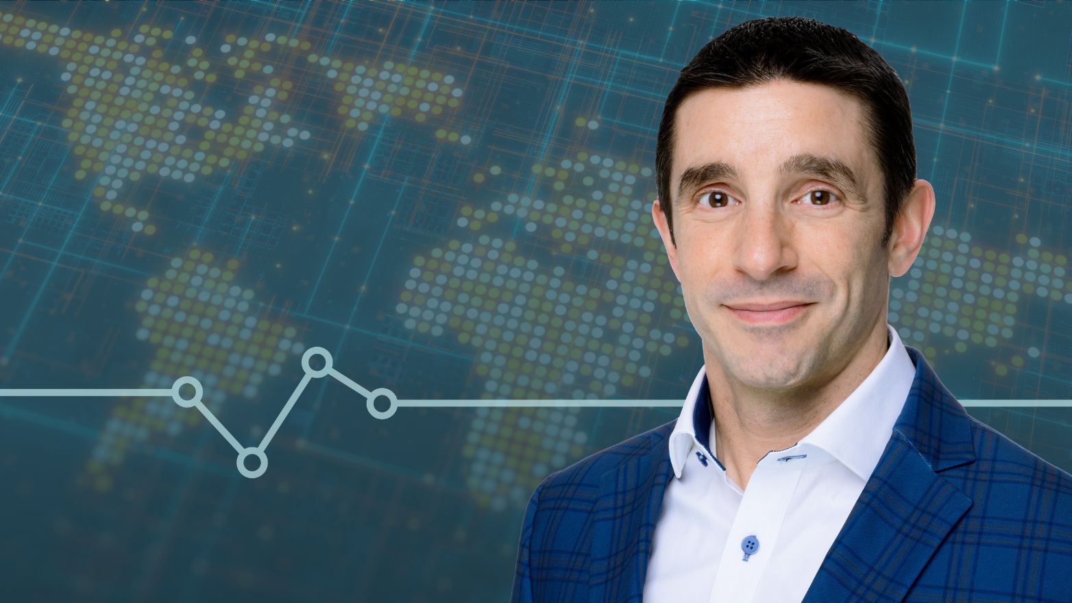 Man in a blue plaid blazer and white shirt smiling in front of a digital background with a dotted world map and a line graph.