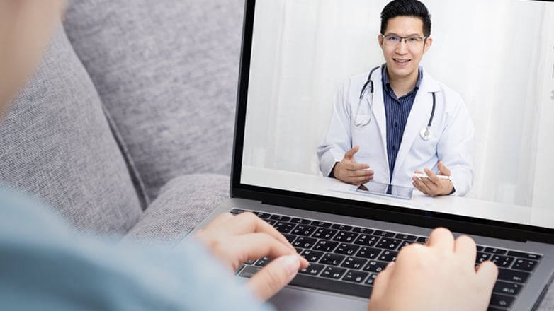 doctor consulting with patient over video chat