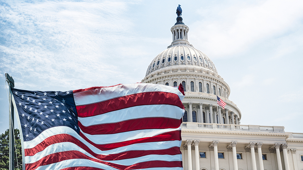 us capitol building with flag