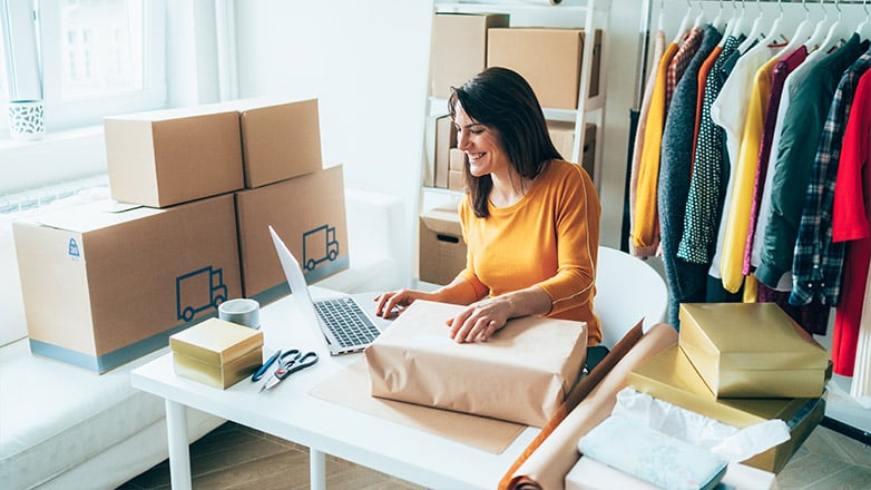 business woman fulfilling an online order in her small shop.