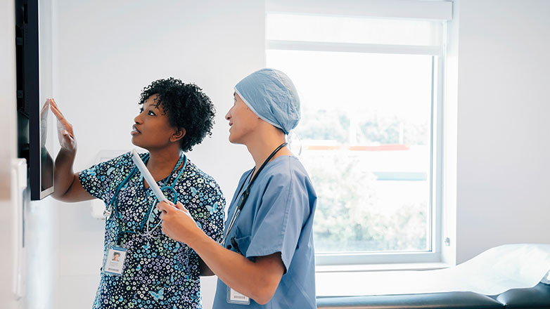 Doctor and nurse reviewing patient tests.