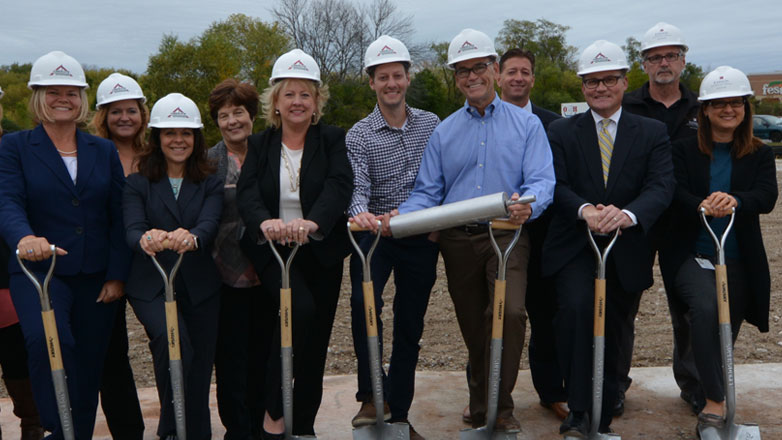 The JFG team lines up for the groundbreaking of our new insurance office building in 2017.