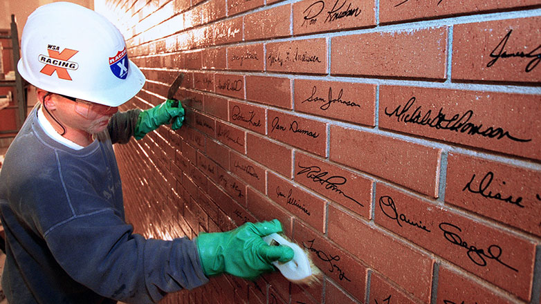 The Johnson Building Wall of Pride signatures getting final touches in 2002.