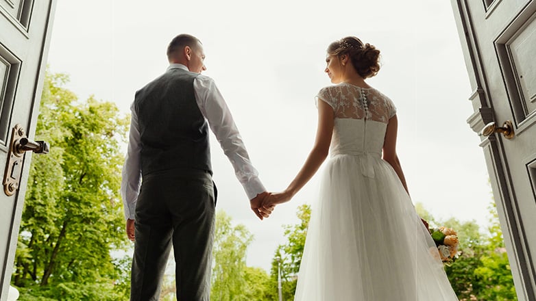 young married couple looking outward