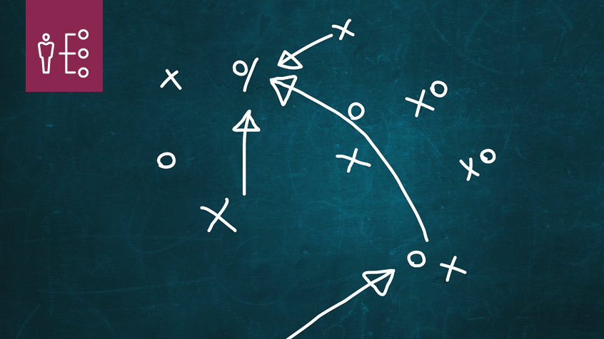 playbook on chalkboard