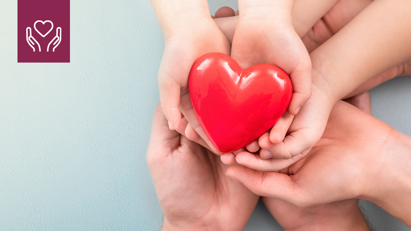 three sets of hands holding heart