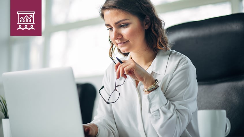 woman at desk with laptop