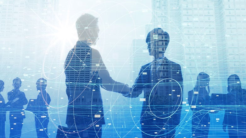 people shaking hands with coworkers in background with digital elements overlaying