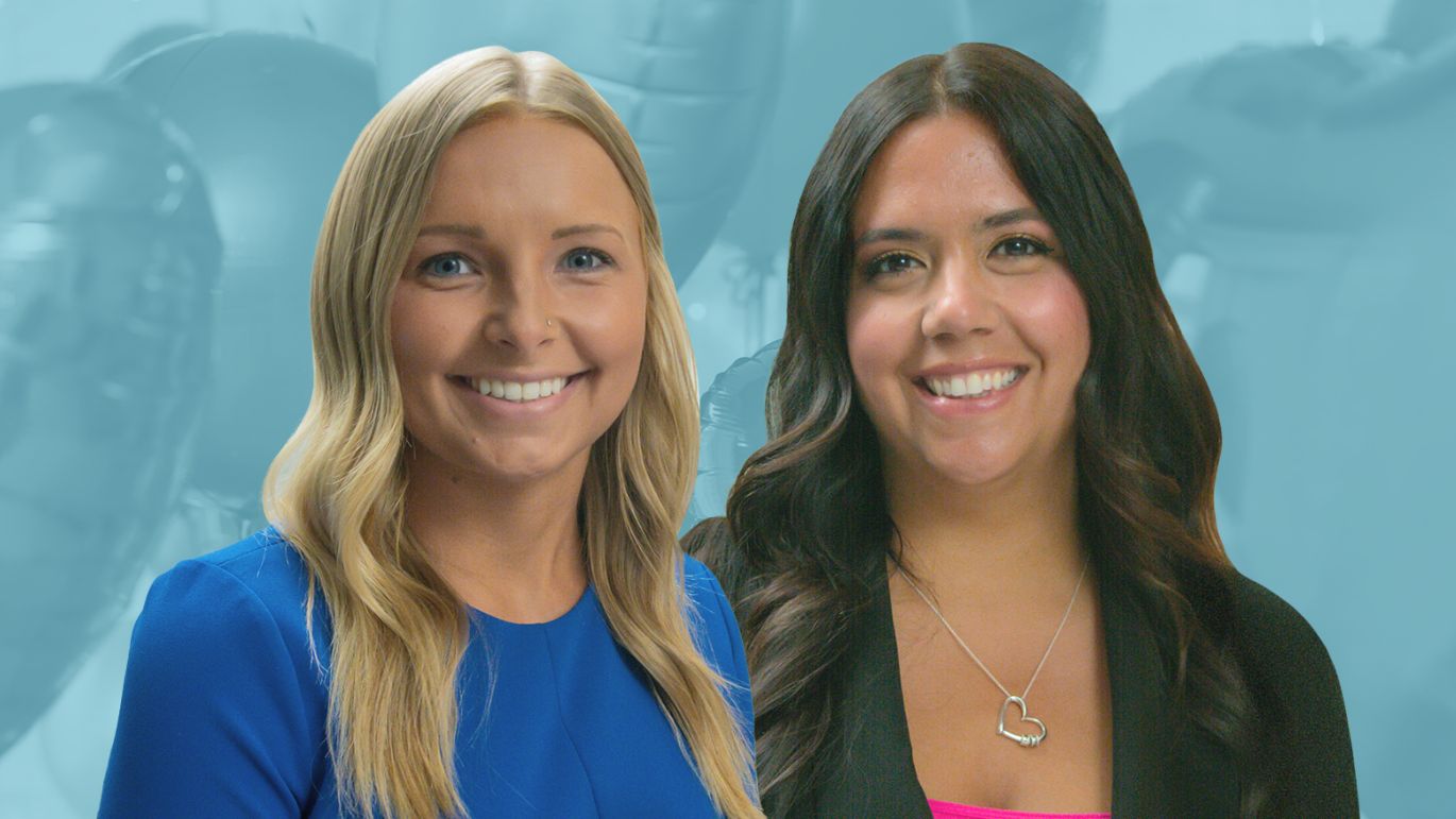 Two people posed against a blue-toned podcast microphone background.