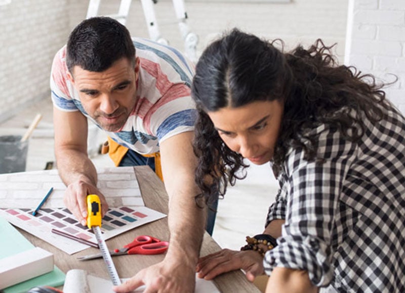 Couple working together on home renovations.