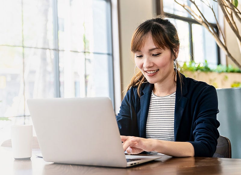 woman working on laptop at desk