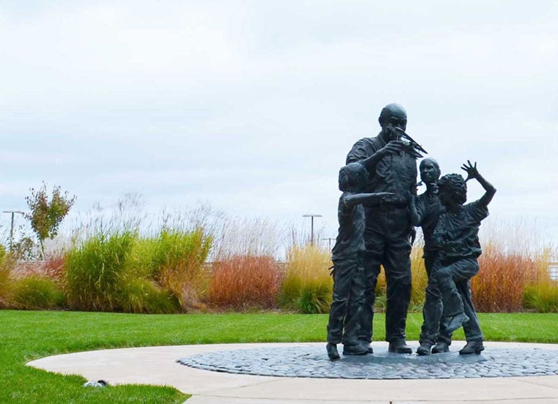 Statue of Sam Johnson in the courtyard of the Johnson Financial Group main office.